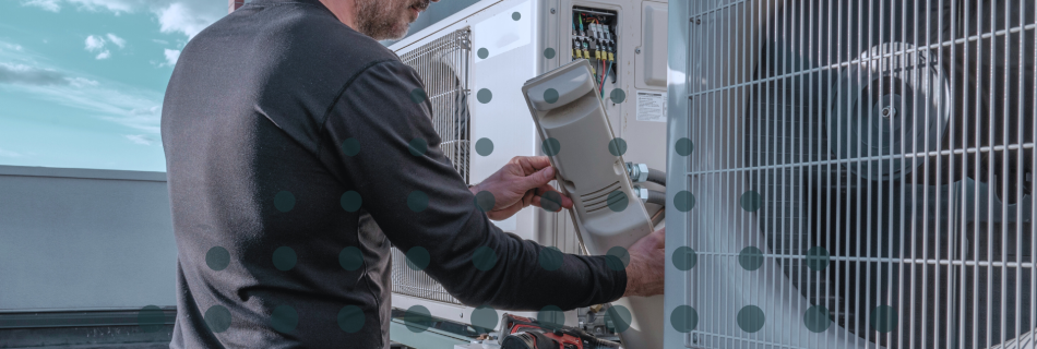 A tradesmen providing HVAC maintenance on a rooftop unit